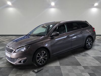 the grey toyota sienna is parked in a large room with a checkered floor