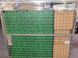 a metal cart with several boxes on it in a warehouse