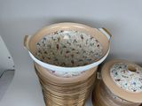 three baskets that are sitting on a shelf next to each other