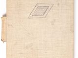 an old book sitting on top of a table with a label on it
