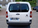 a white van that is parked on the side of the road