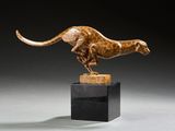 a bronze sculpture of a cheetah on a marble base