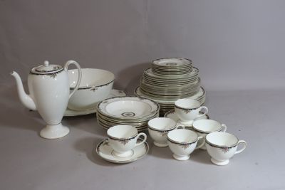 a lot of dishes and cups on the table