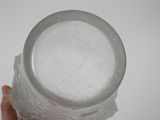 a person holding a glass of water in their hand