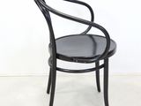 black bent bent chair with black leather seat and backrest