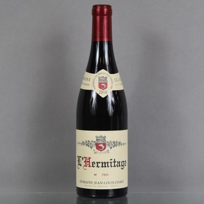 a bottle of wine that is sitting on a table