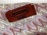 the label is on the back of a purple and white dress