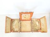 an open suitcase sitting on top of a white floor