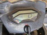 a close up of a motorcycle with a speedometer on it