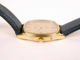 an image of a close up of a watch on a white surface