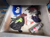 a person that is holding a can of soda in a drawer