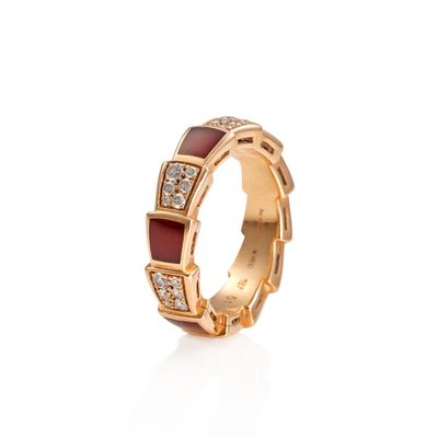 a close up of a ring with diamonds on a white background