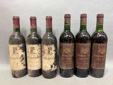 six bouteilles de vin sont alignées sur une table