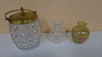 three glass vases sitting on a table next to each other