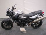 a picture of a motorcycle parked on a tile floor