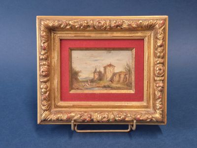 un vieux cadre contenant un tableau représentant un château en arrière-plan