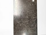 an image of a piece of metal on a white surface