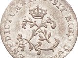 a close up of a coin with a crown on it