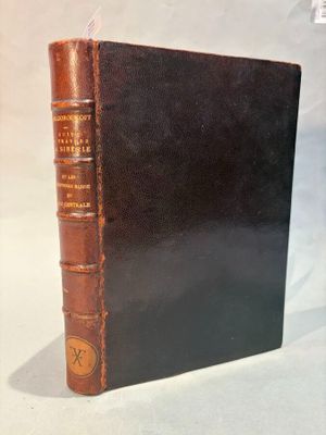 an old book sitting on top of a table next to a white background