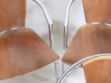 four chairs that are sitting next to each other