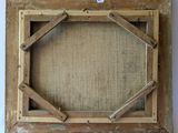 an old picture frame with a piece of wood in the middle of it
