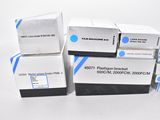 four boxes of blue and white ink sitting on top of each other