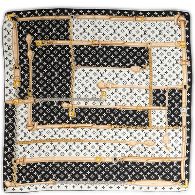 a black and white square scarf with a gold border