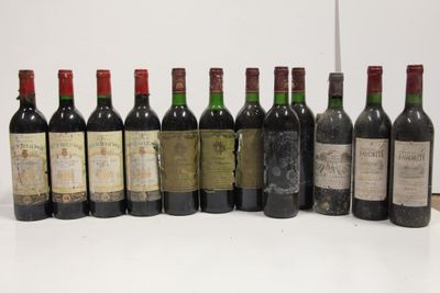 several bottles of wine are lined up on a table