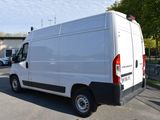 a white van that is parked in a parking lot