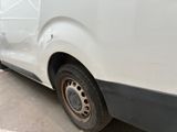 a white van that is parked on the side of the street
