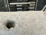 a close up of a piece of metal with a hole in it