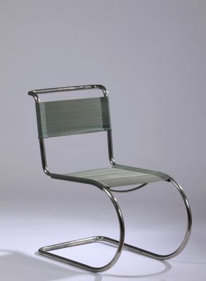 an image of a chair with a metal frame and a green seat