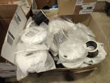 a cardboard box filled with assorted items on the floor