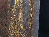 a close up of an old book with a painting on it