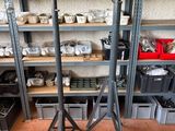 many shelves of pottery on the shelves in the room