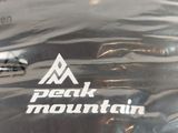 a close up of a bag with a mountain logo on it