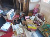 a pile of boxes on the floor of a room