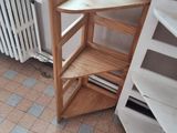 a wooden staircase next to a radiator in a room