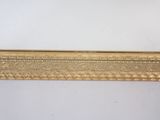 a gold frame with a decorative pattern on the edge of it