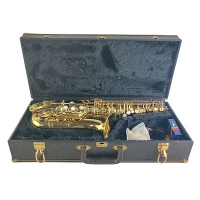 a saxophone in a black case with gold hardware