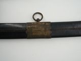 a black belt with a gold buckle on it