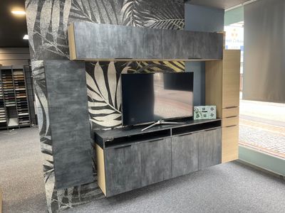 a tv that is sitting on a stand in a room