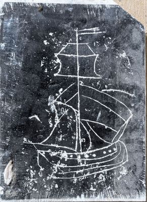 a chalk drawing of a ship on a blackboard