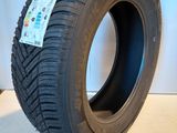 a close up of a tire on a white surface