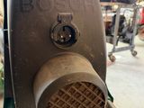 a close up of a blower with a hose attached to it