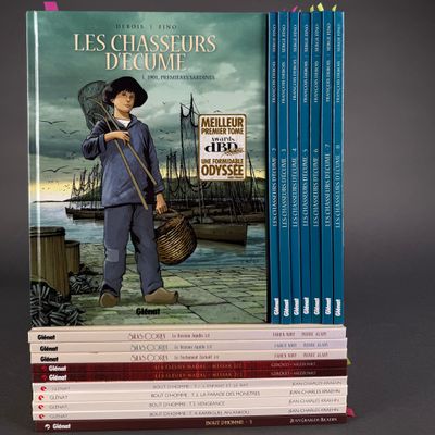 a lot of books that are stacked on top of each other