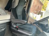 an image of the inside of a van with the door open