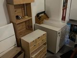 a room with a lot of boxes and a desk in it