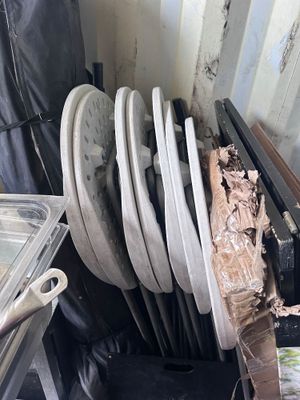 a pile of dirty dishes and pans in the kitchen