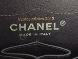 a close up of a chanel bag with the label on it